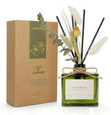 SAUSSAVITA White Jasmine reed diffuser with dried botanicals, green bottle, twine bow beside Lily & Jasmine box